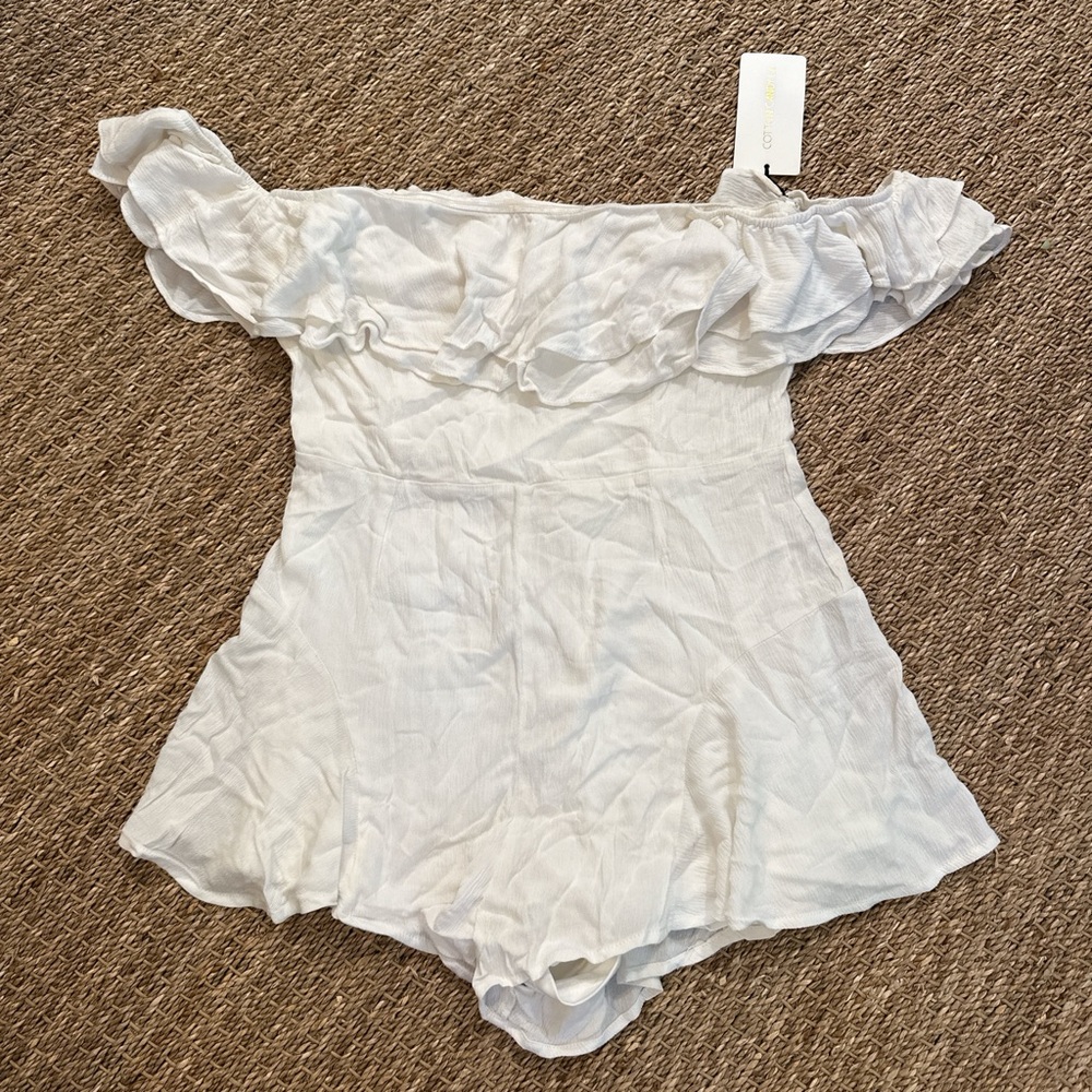 White off the shoulder romper. New with tags, large. Ruffles & lined.